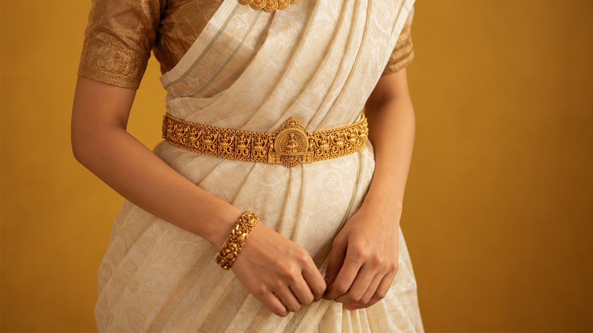 Temple oddiyanam hip belt worn over a silk saree, in gold-plated 925 silver - Vilva Jewels Chennai